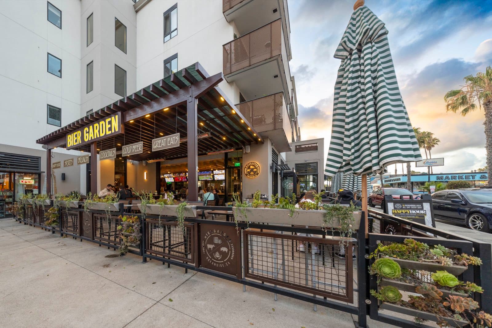 The downtown Oceanside storefront and patio at golden hour on North Cleveland Street