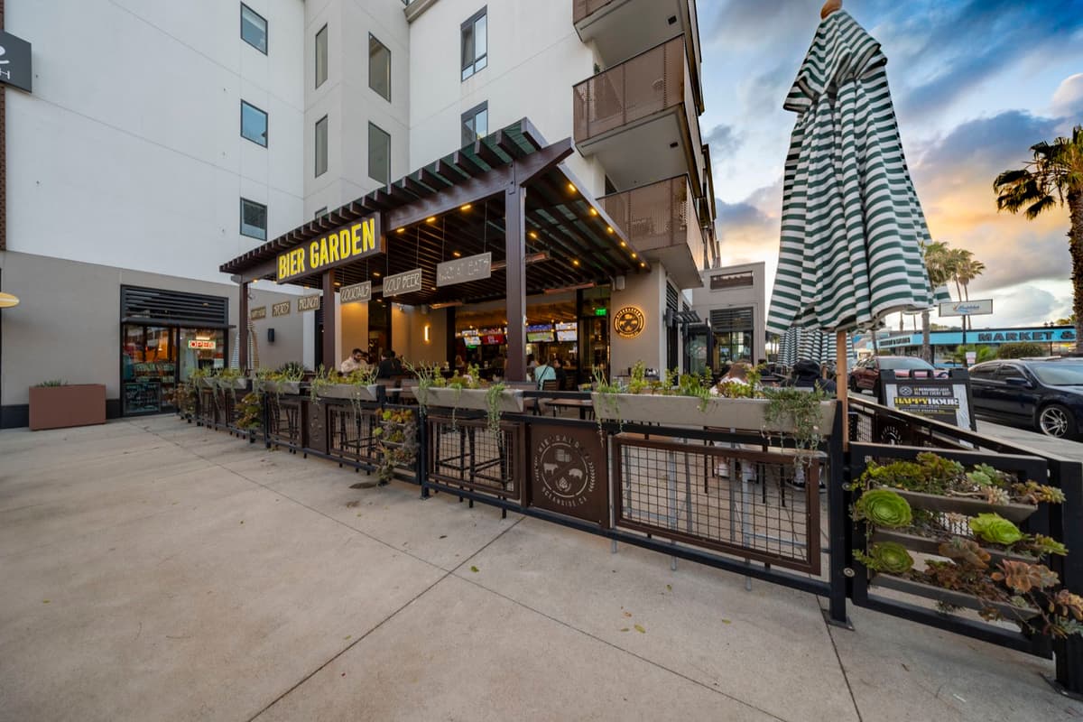 The Bier Garden Oceanside patio along Cleveland Street at sunset